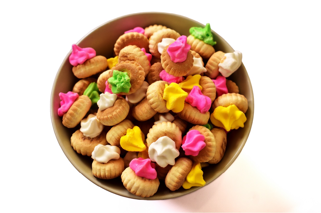 A bowl of colourful iced gem biscuits